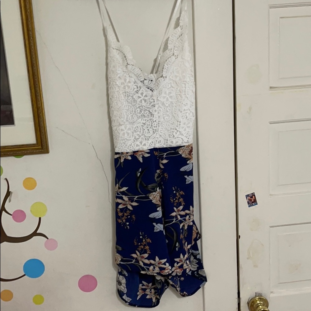 white/blue floral strappy romper with bow on back